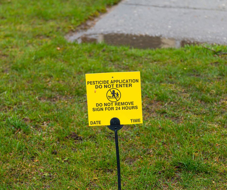 Stay off grass sign due to spraying of the DDT Banned product